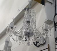 Five-branch electrolier with glass drops  The chandelier measures very approx 49cms diam and 50