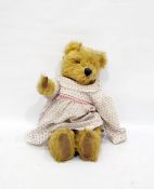 Gold plush music box bear with glass eyes, straw stuffed in a flower dress, height 45cm