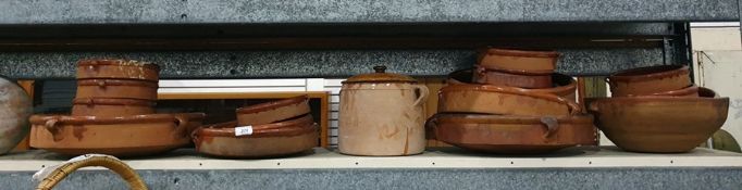 Collection of terracotta cooking pots, flan dishes, casseroles, tartiflette dishes etc