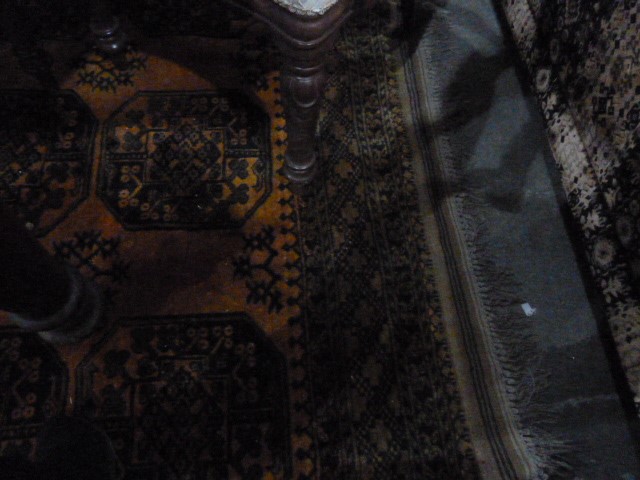 Burnt orange ground Eastern style floor rug, the central field decorated with elephant foot guls, - Image 3 of 5