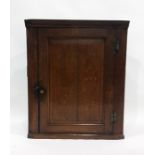 19th century oak wall-hanging corner cupboard with single panelled door enclosing shelves The