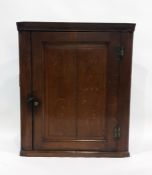 19th century oak wall-hanging corner cupboard with single panelled door enclosing shelves The