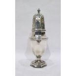 Silver caster by S W Smith & Co, Birmingham 1910, of panelled baluster form with pierced cover, 20cm