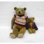 Large gold plush straw stuffed bear with glass eyes and stitched nose in a knitted jumper, height