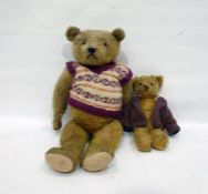 Large gold plush straw stuffed bear with glass eyes and stitched nose in a knitted jumper, height