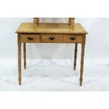 Pine hall table with bamboo moulded edge, above three drawers, on bamboo effect turned supports,