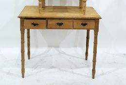 Pine hall table with bamboo moulded edge, above three drawers, on bamboo effect turned supports,