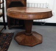 Circular walnut centre table on faceted pedestal base, 77cm  62 cms in height  Please see images for