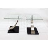 Pair of modern glass-topped side tables with swept brushed steel supports to smoky glass base (2) (