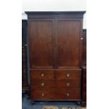 19th century mahogany linen press with ogee moulded pediment above the two doors, enclosing five