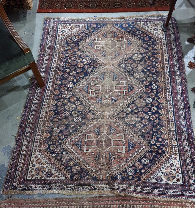 Antique Eastern wool carpet with triple lozenge totem to the midnight blue field having allover