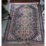 Antique Eastern wool carpet with triple lozenge totem to the midnight blue field having allover