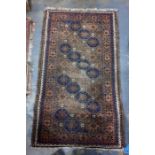 Eastern style brown ground rug with repeating hooked motif pattern 150 x 85 cm