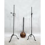 Pair of wrought iron adjustable floor lights with tripod bases and a copper warming pan (3)