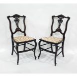 Pair of 19th century bedroom chairs with carved and pierced vase-shaped back splats, stretchered