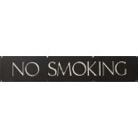 Enamel sign "No Smoking" with white lettering on a brown ground, 66cm long
