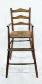 Vintage ladderback child's high chair with rush seat