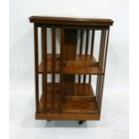 Edwardian inlaid mahogany revolving bookcase, square, the top inlaid with circular fan pattera and