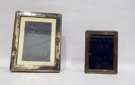 Modern silver plated mounted photograph frame of plain rectangular design, 22cm x 17cm and another