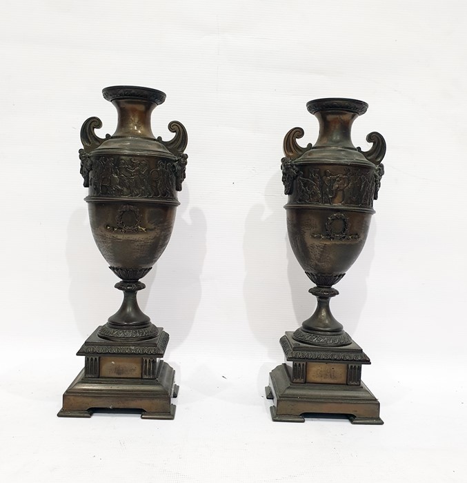 Pair of spelter garniture urns, bronzed-effect depicting Grecian urns with frieze above laurel