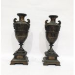 Pair of spelter garniture urns, bronzed-effect depicting Grecian urns with frieze above laurel