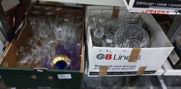 Two boxes of glassware to include wine glasses, a glass decanter, bowls, etc