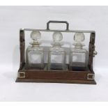 Oak tantalus containing set of three strawberry cut decanters , at present it is locked and there is