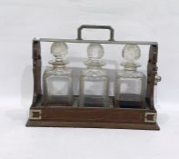 Oak tantalus containing set of three strawberry cut decanters , at present it is locked and there is