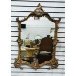 Reproduction gilt wall mirror, rococo style with lion mask decoration