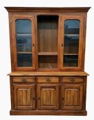 20th century dresser with moulded pediment above central open recess with adjustable shelves,