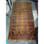 Mustard yellow ground Eastern rug, the mustard central field decorated with two rows of nine