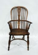 Antique country yew and elm Windsor style armchair on turned supports with crinoline stretcher