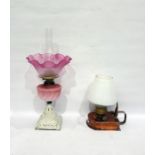 Copper carrying oil lamp with brass fitting and another oil lamp with pink frill rim shade, opaque