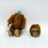 Schuco scent bottle in the form of a monkey, with articulated body and felt hands and feet (interior