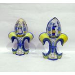 Pair of H R Quimper 'Fleur De Lys' shaped vases, each decorated with Petit Breton of male playing