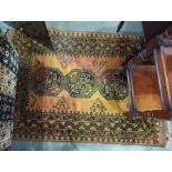 Mustard ground Eastern floor rug with three central medallions decorated in black, 133cm x 102cm