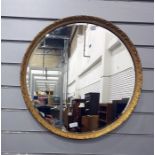 Circular bevelled wall mirror in gilt decorated frame  The mirror has a diameter of 53cm