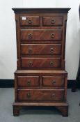 20th century miniature mahogany chest on chest with ogee moulded top above two short and three