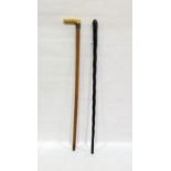 Bamboo cane with worked ivory handle and silver cuff and an African turned hardwood cane (2)