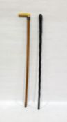 Bamboo cane with worked ivory handle and silver cuff and an African turned hardwood cane (2)