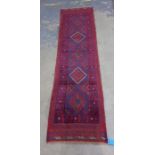 Meshwani runner decorated in red, blue and cream