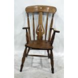 Beech and elm carver chair with pierced vase-shaped back splat, the whole raised upon turned front
