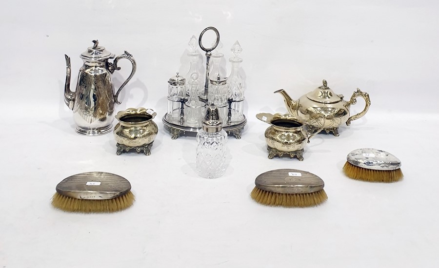 Silver plated cruet set of oval form with six divisions for glass bottles, a pair of silver-backed