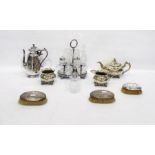 Silver plated cruet set of oval form with six divisions for glass bottles, a pair of silver-backed