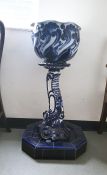 Blue and white pottery jardiniere and stand, the jardiniere with whorl patterned sides and wavy rim,