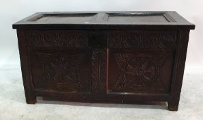 Antique coffer with flowerhead carved panels to front