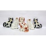 Two pairs of Staffordshire spaniel ornaments, one white pair with gilt hightlights, the other