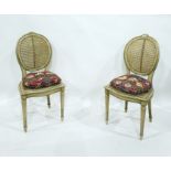 Pair of French style cane-back occasional chairs, the oval back with floral pediment, cane seat,