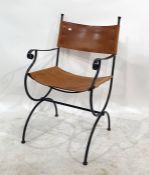 Wrought iron and brown hide open armchair
