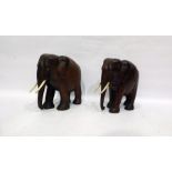 Pair of carved hardwood elephants with bone tusks (2)